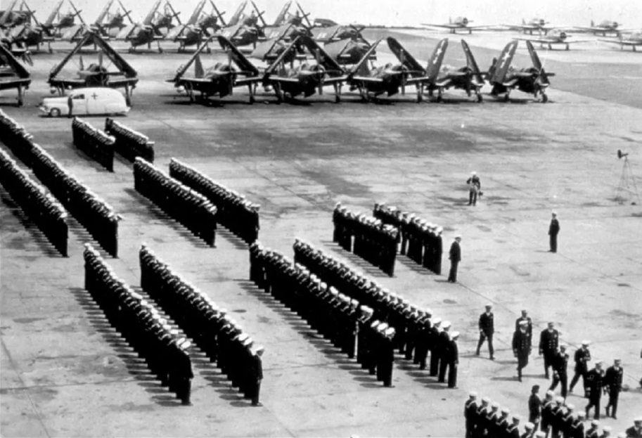A formation of Navy planes flying over the coast, typical of patrols from Floyd Bennett Field.